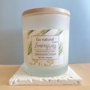 Scented candle with lemongrass essential oil